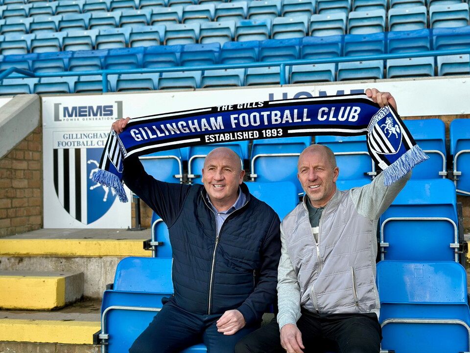 John Coleman and Jimmy Bell lift scarf in dugout